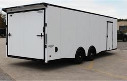 MIDNIGHT EDITION PACKAGE 8.5W (Blackout Package) (with V-Nose or Slant Wedge) (Stoneguard & 'J' Rails, Fenders Inside & Out, Bottom Trim, Top Rail & Trim Screws, Drip Rail for Side & Rear Door, Rear Barlocks w/Hardware, Side Door Trim, Door Holdbacks, Top Rear Corners, Bezels on Fender & Tail Lights, Stainless Steel Centre Caps on Black Mod Wheels, Black Centre Caps on Aluminum Wheels, Silver or Carbon Fiber Decals, Black Sidewall Vents)